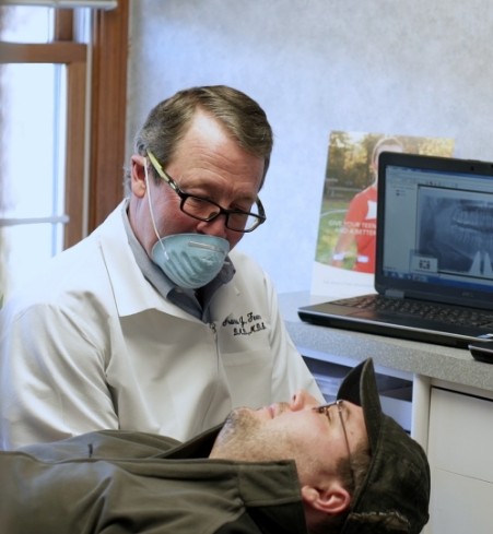 Doctor Feeney talking to orthodontic patient