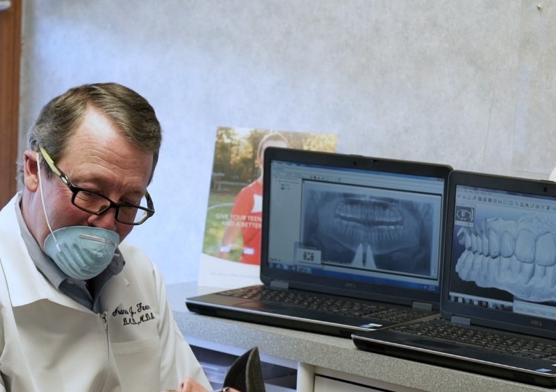 Orthodontist talking to patient