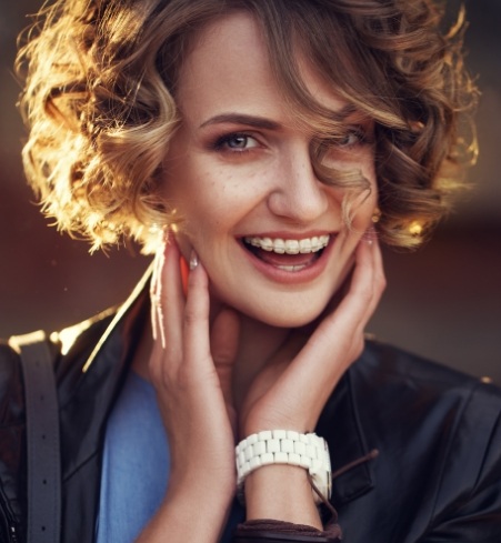 Smiling woman receiving adult orthodontics