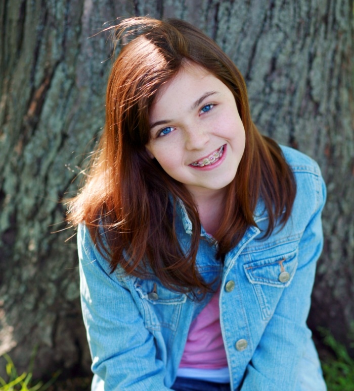 Smiling teen with traditional braces