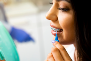 a patient examining their braces