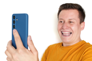 a person with braces smiling for a picture